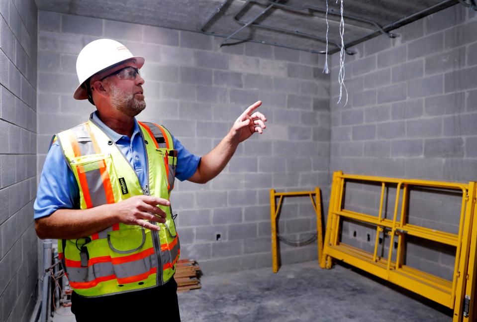 Jamie Marks with the Robins & Morton construction firm shows off the room for the computers and control system for Smyrna Fire Station 4 that has walls that are extra secure, on Tuesday, April 30, 2024.
