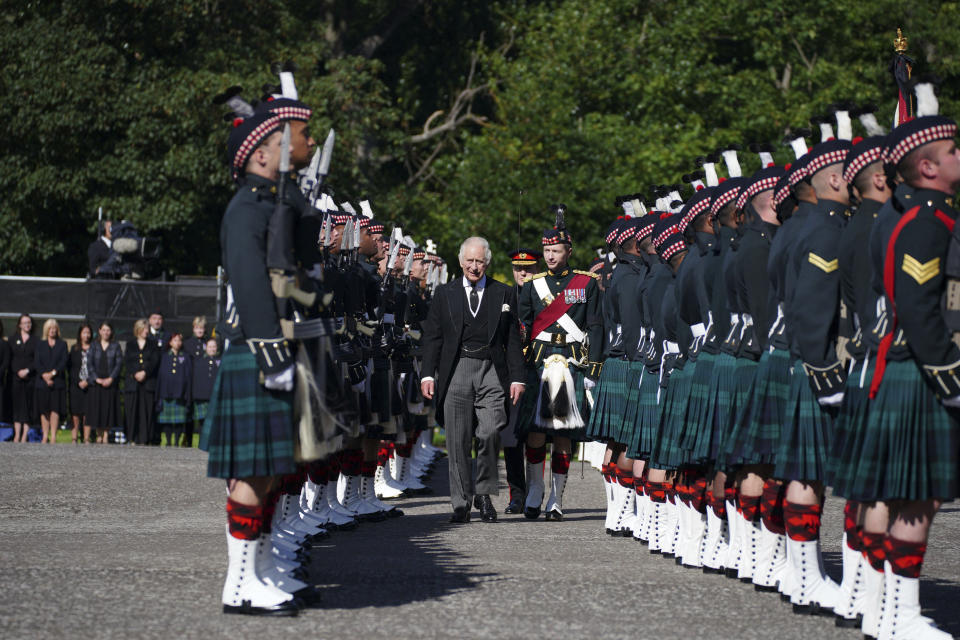 King Charles III inspects the Guard of Honour as he arrives to attend the Ceremony of the Keys, at the Palace of Holyroodhouse, Edinburgh, Monday, Sept. 12, 2022. King Charles arrived in Edinburgh on Monday to accompany his late mother’s coffin on an emotion-charged procession through the historic heart of the Scottish capital to a cathedral where it will lie for 24 hours to allow the public to pay their last respects. (Peter Byrne/Pool Photo via AP)