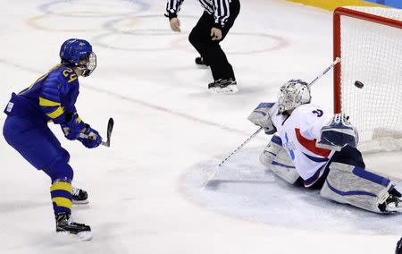 Ice Hockey - Pyeongchang 2018 Winter Olympics - Women’s Classification Match - Sweden v Korea - Kwandong Hockey Centre, Gangneung, South Korea - February 20, 2018 - Erika Grahm of Sweden scores against Shin So-jung of Korea. REUTERS/David W Cerny