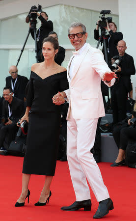The 75th Venice International Film Festival - Screening of the film "The Mountain" competing in the Venezia 75 section - Red Carpet Arrivals - Venice, Italy, August 30, 2018 - Actor Jeff Goldblum gestures next to his wife Emilie Livingston. REUTERS/Tony Gentile/Files