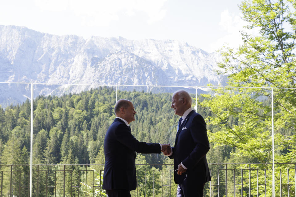 German Chancellor Olaf Scholz, left, welcomes US President Joe Biden, right, for a bilateral meeting at Castle Elmau in Kruen, near Garmisch-Partenkirchen, Germany, on Sunday, June 26, 2022. The Group of Seven leading economic powers are meeting in Germany for their annual gathering Sunday through Tuesday. (Leonhard Foeger/Pool Photo via AP)