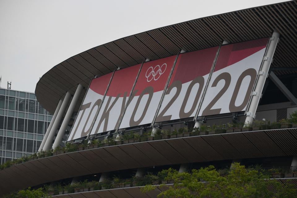 The logo of Tokyo 2020 is displayed at the National Stadium, main venue for the Tokyo 2020 Olympic and Paralympic Games in Tokyo on July 7, 2021, as reports said the Japanese government plans to impose a virus state of emergency in Tokyo during the Olympics. (Photo by Kazuhiro NOGI / AFP) (Photo by KAZUHIRO NOGI/AFP via Getty Images)