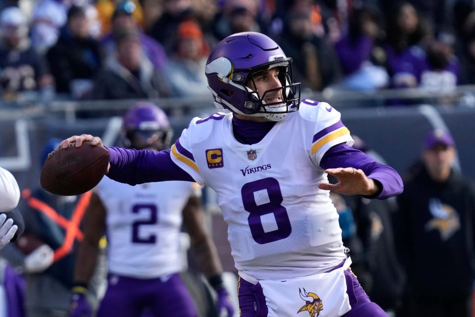 Minnesota Vikings quarterback Kirk Cousins (8) throws a pass during the first half of an NFL football game against the Chicago Bears, Sunday, Jan. 8, 2023, in Chicago. (AP Photo/Nam Y. Huh)