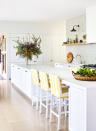 <p>Equal parts preppy and bohemian, contemporary and timeless, this kitchen by <a href="https://annaspirodesign.com.au/" rel="nofollow noopener" target="_blank" data-ylk="slk:Anna Spiro Design;elm:context_link;itc:0;sec:content-canvas" class="link ">Anna Spiro Design</a> is an eclectic dream. A lone floating shelf in line with the bottom of the hood is visually arresting and streamlined. </p>