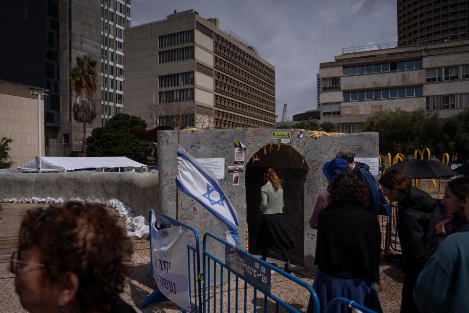 People line up to enter an installation in Tel Aviv, Israel, simulating a tunnel in Gaza in an act of solidarity with hostages believed to be held underground by Hamas and calling for their return on March 19, 2024.