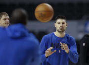 Orlando Magic's Nikola Vucevic receives a pass during a basketball practice at Mexico City Arena in Mexico City, Wednesday, Dec. 12, 2018. Magic will face the Chicago Bulls Thursday and the Utah Jazz Saturday in two 2018 regular-season NBA games to be played in the high-altitude Mexican capital .(AP Photo/Rebecca Blackwell)