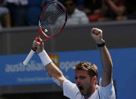 Stan Wawrinka of Switzerland celebrates after defeating Guillermo Garcia-Lopez of Spain during their men's singles fourth round match at the Australian Open 2015 tennis tournament in Melbourne January 26, 2015. REUTERS/Thomas Peter