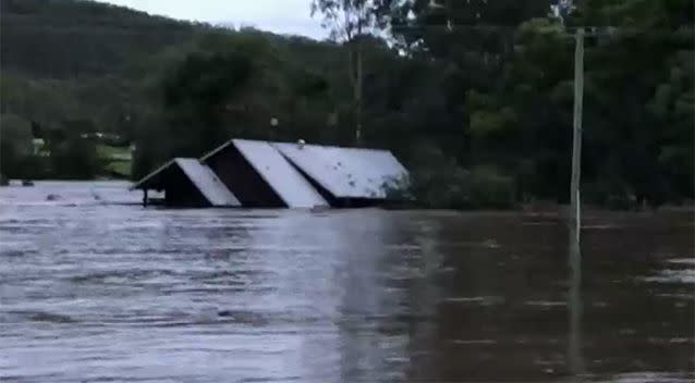 The house broke free of its bearings moments after the family was rescued. Source: ABC