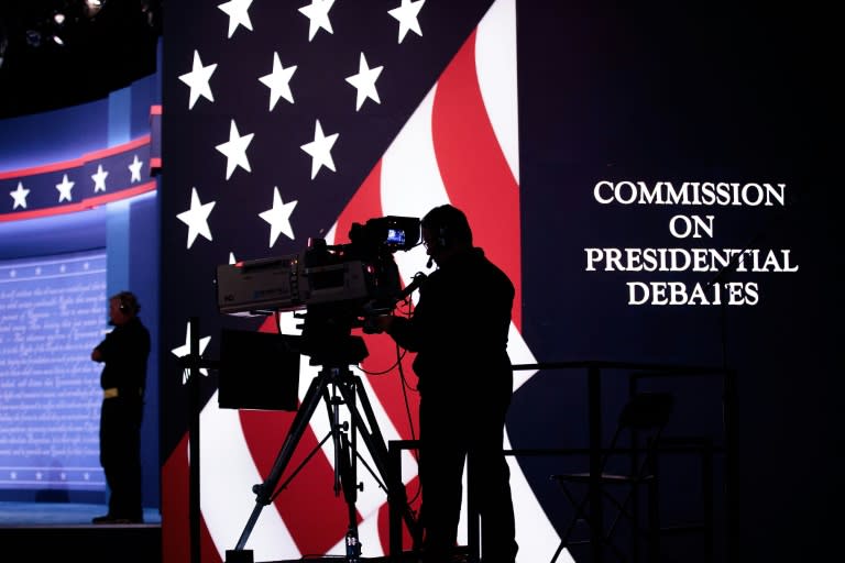 Television news crews prepare for the first presidential debate at Hofstra University