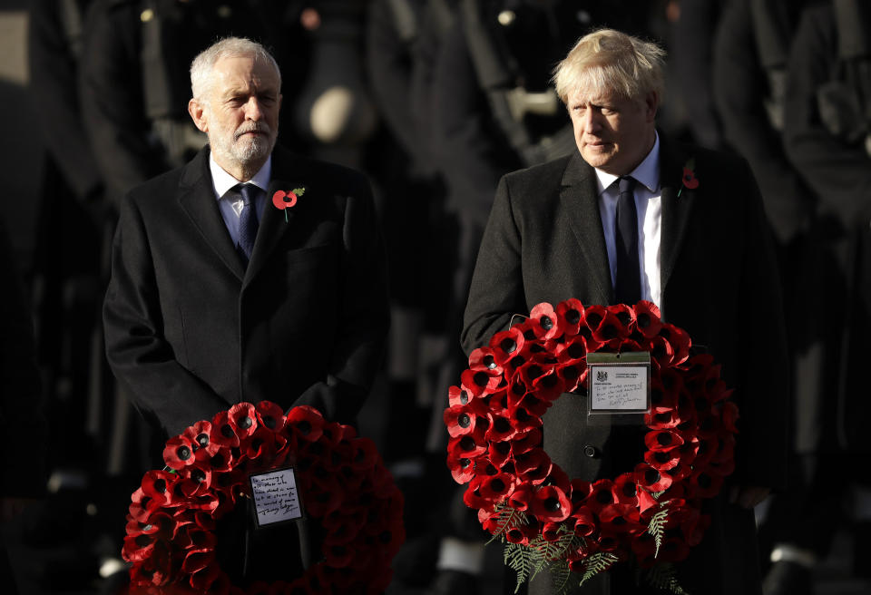 FILE - In this Sunday, Nov. 10, 2019 file photo British Prime Minister Boris Johnson, right, and leader of the Labour Party Jeremy Corbyn prepare to lay wreaths during the Remembrance Sunday ceremony at the Cenotaph in Whitehall in London. (AP Photo/Matt Dunham)