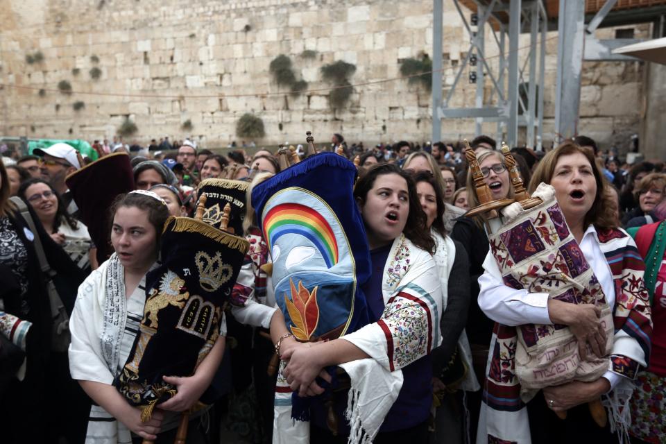Israeli members of the liberal Jewish religious group Women of the Wall, carry a Torah scroll after prayers in the women's section of the Western Wall, in the Old City of Jerusalem on Nov. 2, 2016, during a protest by the group demanding equal prayer rights at the site.