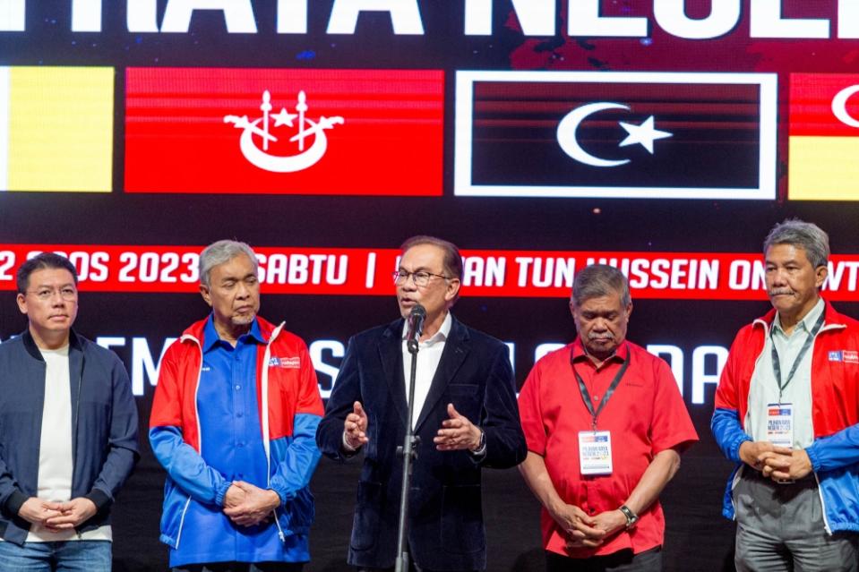 Prime Minister and Pakatan Harapan chairman Datuk Seri Anwar Ibrahim (centre) is seen with other leaders of his coalition during a press conference at World Trade Centre in Kuala Lumpur August 12, 2023. — Picture by Firdaus Latif