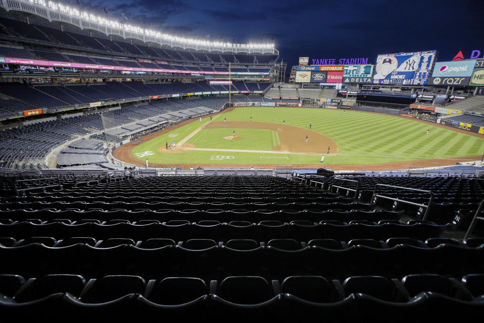 Stands remain empty of spectators in the fourth inning of a baseball game between the New York Yankees and the Boston Red Sox, Saturday, Aug. 1, 2020, in New York. (AP Photo/John Minchillo)