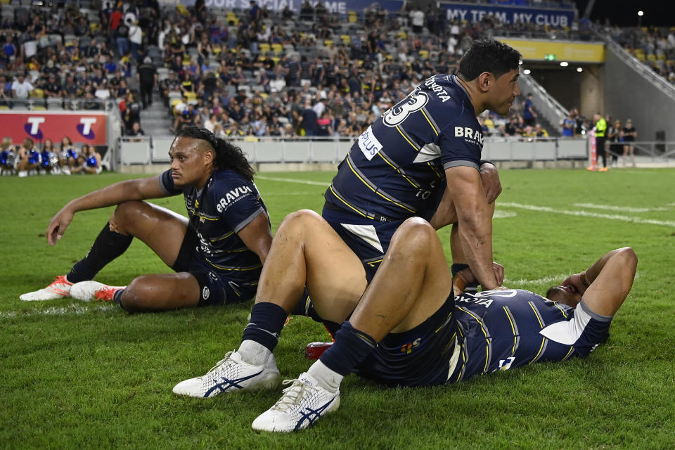 Cowboys players, pictured here looking on dejected after their preliminary final loss to Parramatta.