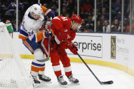 New York Islanders defenseman Scott Mayfield (24) defends against Detroit Red Wings center Valtteri Filppula (51) behind the Islanders' net during the first period of an NHL hockey game Friday, Feb. 21, 2020, in Uniondale, N.Y. (AP Photo/Kathy Willens)