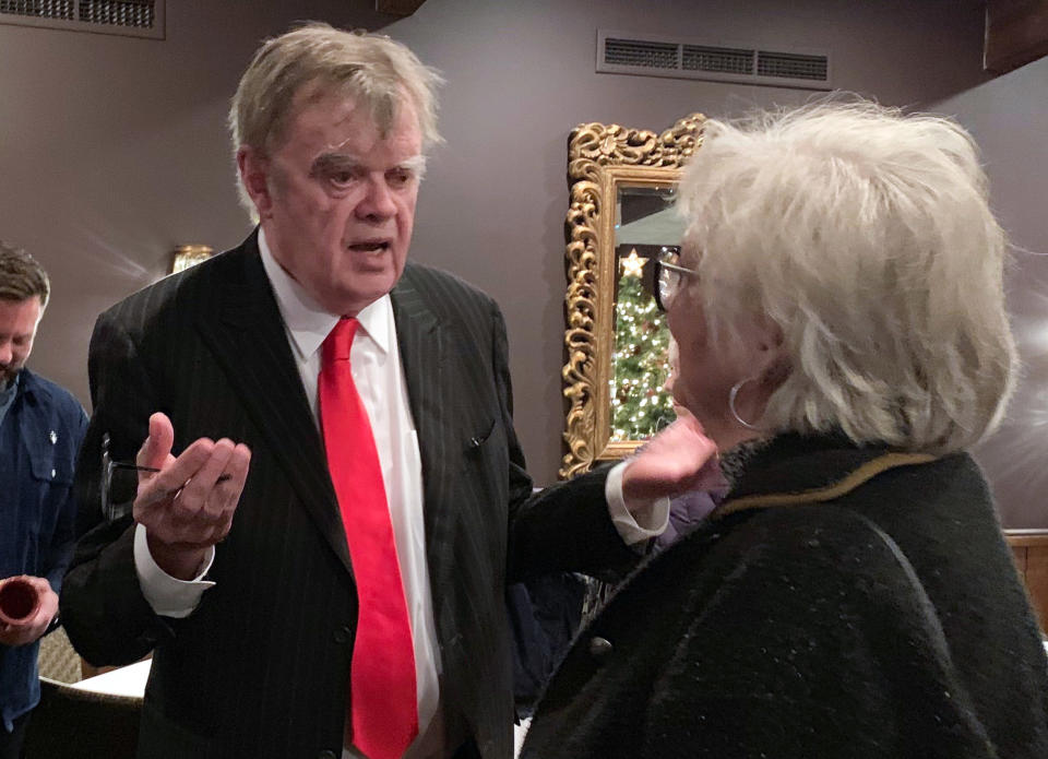 In this Sunday, Dec. 16, 2018, former "A Prairie Home Companion" host Garrison Keillor talks to fans after his performances at Crooners lounge in Fridley, Minn. Keillor is stepping back into the spotlight a year after Minnesota Public Radio cut ties with him over a sexual misconduct allegation. Keillor performed two sold-out shows Sunday night at Crooners, a jazz nightclub in a Minneapolis suburb near where he grew up. Fans laughed, applauded and sang along. (AP Photo/Jeff Baenen)