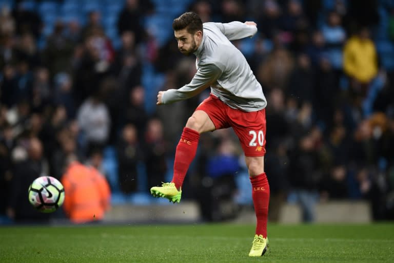 Liverpool's midfielder Adam Lallana warms up ahead of the English Premier League football match against Manchester City March 19, 2017