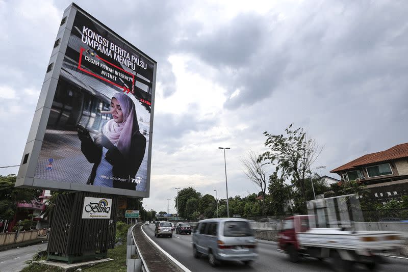 A billboard advertisement discouraging the dissemination of fake news is pictured along Jalan SS20/27, Damansara Jaya March 26, 2018. — Picture by Azneal Ishak