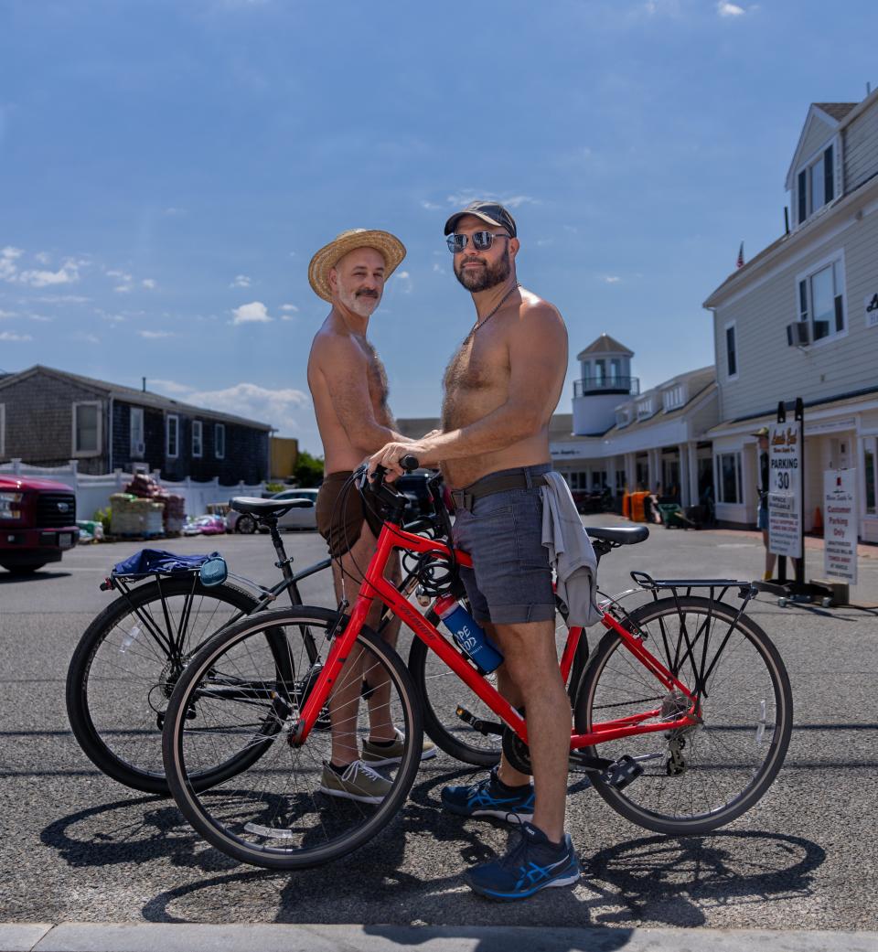 Keith Sweeney and Don Aigner from Charlotte, North Carolina are on vacation biking Wednesday morning through Provincetown.