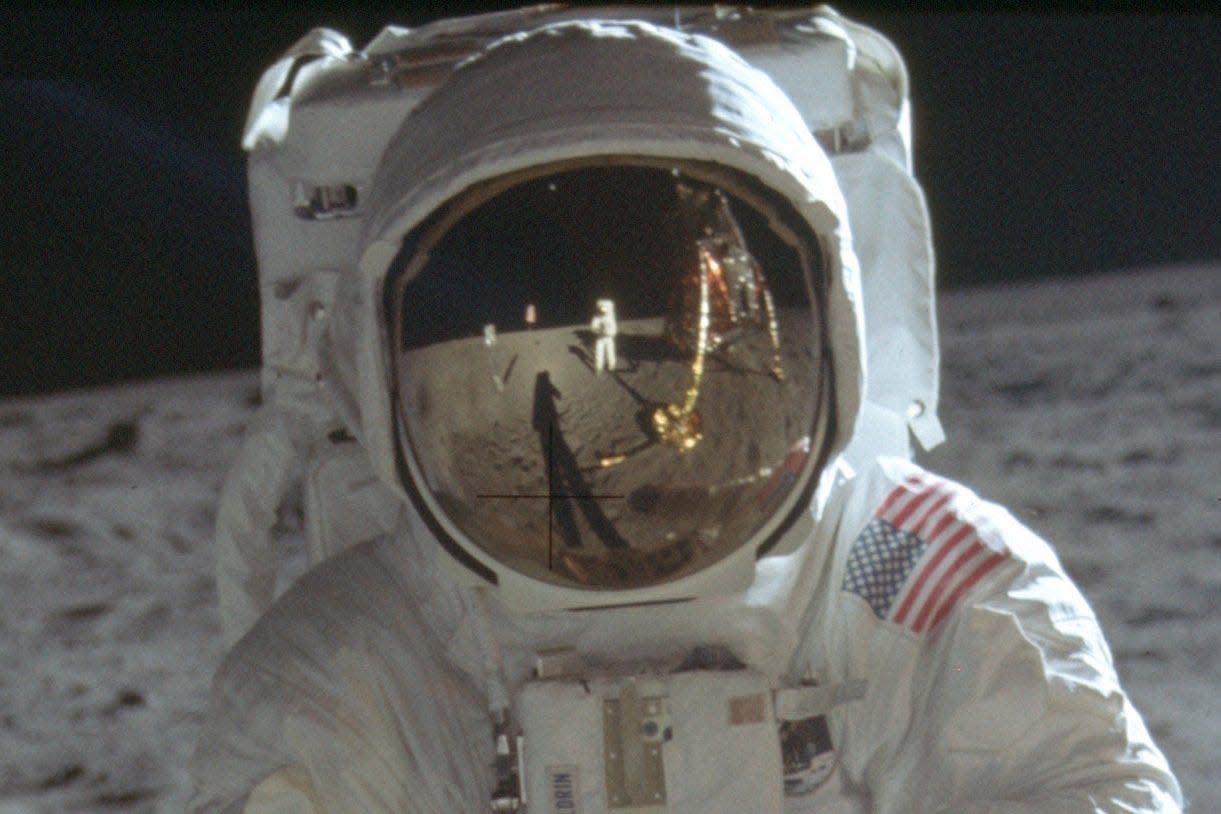 A July 20, 1969 photo shows astronaut Neil Armstrong reflected in the helmet visor of Buzz Aldrin on the surface of the moon. The astronauts had a camera mounted to the front of their suits, according to the Universities Space Research Association.