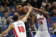 Detroit Pistons guard Cory Joseph (18) and center Isaiah Stewart (28) reach for the ball as Orlando Magic center Wendell Carter Jr. (34) drives to the basket during the first half of an NBA basketball game Friday, Jan. 28, 2022, in Orlando, Fla. (AP Photo/Scott Audette)