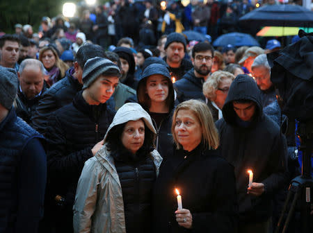 People mourn the loss of life as they hold a vigil for the victims of Pittsburgh synagogue shooting in Pittsburgh, October 27, 2018. REUTERS/John Altdorfer