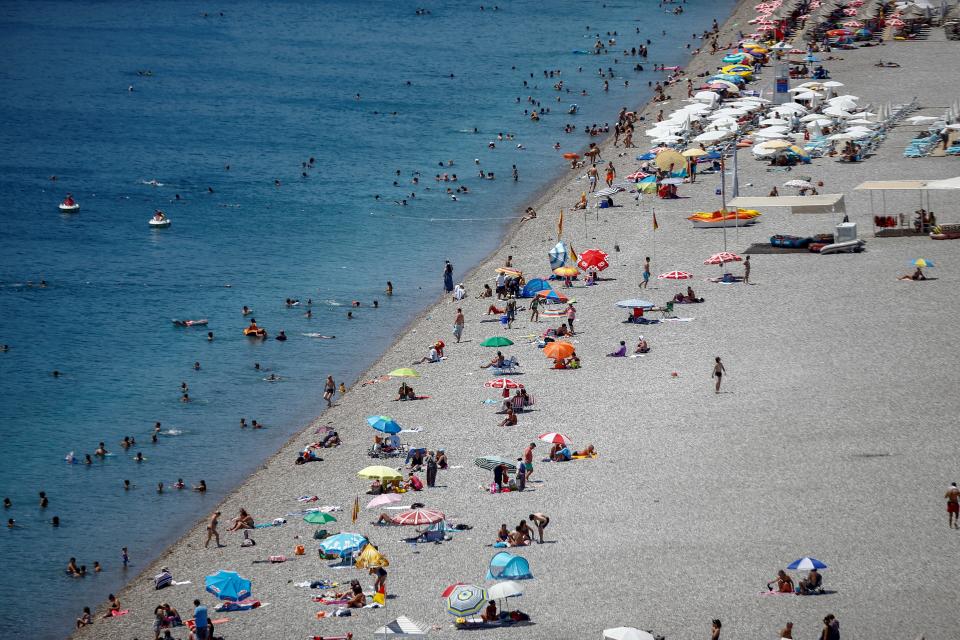 ANTALYA, TURKEY - AUGUST 7 : An aerial view of people enjoying the sea at Konyaalti Beach in Antalya, Turkey on August 7, 2019. Antalya's weather temperature reached 37 degrees Celsius while water temperature was 30 degrees Celsius. (Photo by Mustafa Ciftci/Anadolu Agency via Getty Images)