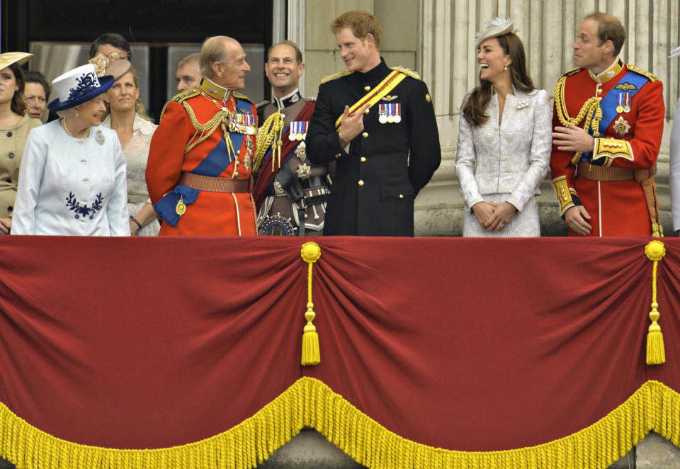(Front L-R) Britain's Queen Elizabeth, Prince Philip, Prince Harry, Prince William, the Duke of Cambridge and his wife, Catherine, the Duchess of Cambridge share a light moment as they stand on the balcony of Buckingham Palace in the annual Trooping of the Colour ceremony to celebrate the Queen's official birthday in central London, June 14, 2014. REUTERS/Toby Melville (BRITAIN - Tags: SOCIETY ANNIVERSARY ROYALS)