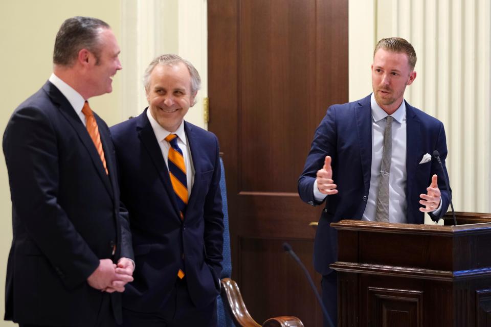 Oklahoma Education Secretary Ryan Walters, right, talks with Senate Pro Tem Greg Treat, center, and House Speaker Charles McCall at a bill signing at the state Capitol on March 31, 2021. Walters and Gov. Kevin Stitt supported a defeated bill from Treat that would have dedicated $128.5 million to children's private-school costs.