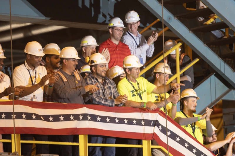 Shipyard workers cheer as President Joe Biden discusses his economic plan at the Philadelphia Shipyard in Philadelphia on Thursday. Photo by Laurence Kesterson/UPI