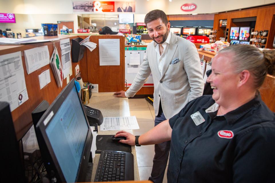 Kum & Go CEO Tanner Krause talks with store manager Whitney Wickham during a visit to her store at 1300 Keo Way in Des Moines, Wednesday, June 9, 2021.