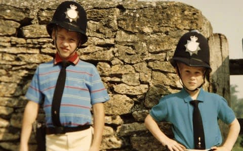Prince William and Prince Harry in borrowed policemen outfits - Credit: PA