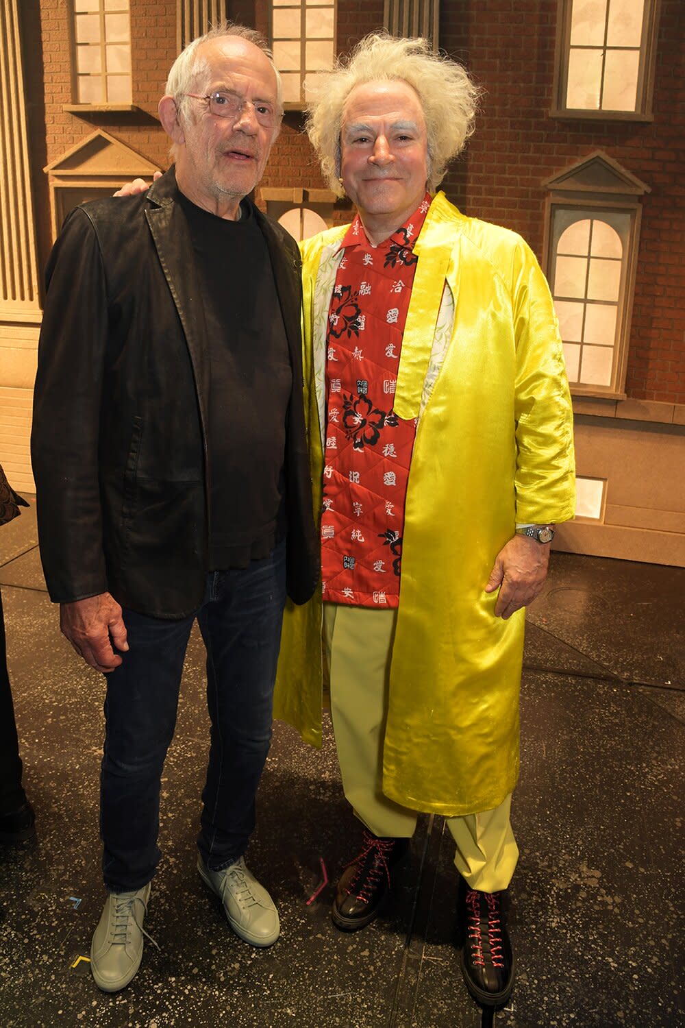 Original "Doc Brown" Christopher Lloyd (L) and cast member Roger Bart pose backstage at the West End production of "Back To The Future: The Musical" at The Adelphi Theatre on July 13, 2022 in London, England.