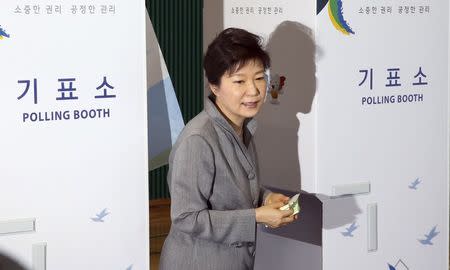 South Korean President Park Geun-hye walks out a voting booth after marking her ballots for the local elections at a polling station in Seoul June 4, 2014. REUTERS/Do Kwang-hwan/Yonhap