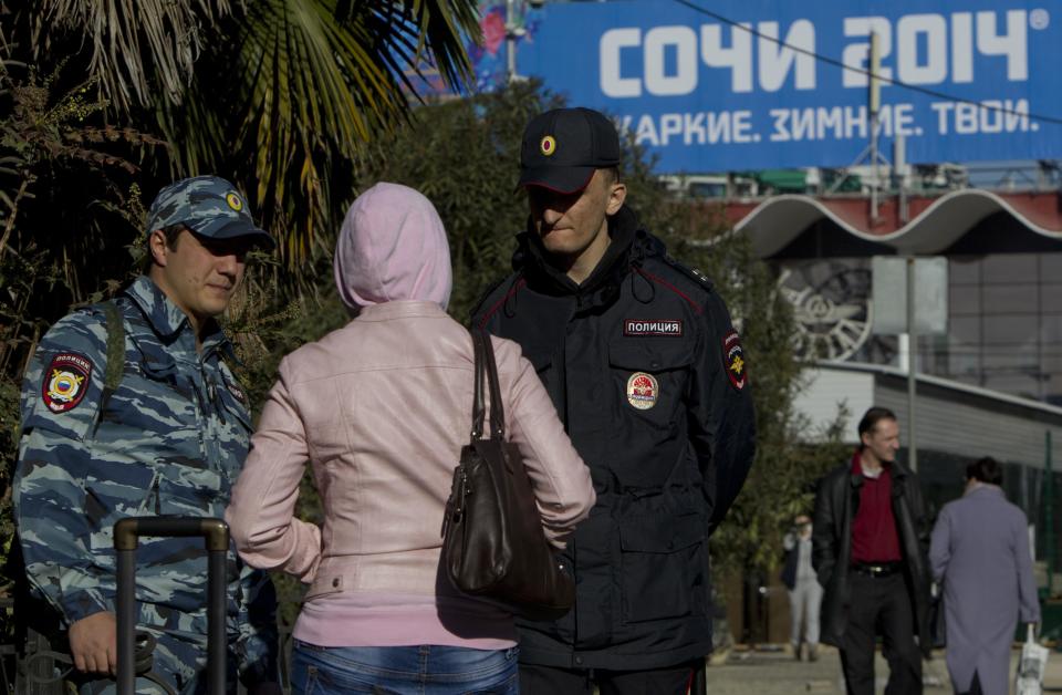 Russian police check a passerby in Sochi