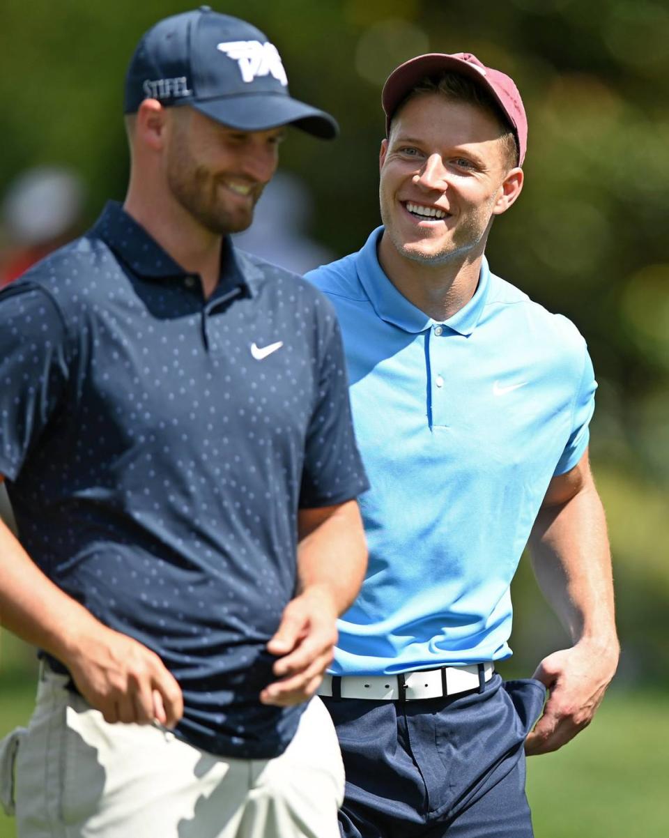 Professional golfer Wyndham Clark, left and Carolina Panthers running back Christian McCaffrey joke during the Wells Fargo Championship Pro-Am on Wednesday, May 5, 2021.