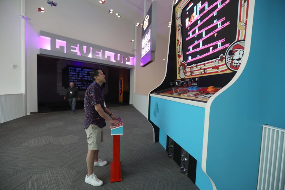 Steven Lin of San Francisco, CA tries to play the giant Donkey Kong.