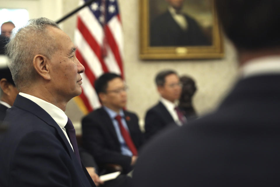 Chinese Vice Premier Liu He listens during a meeting with President Donald Trump in the Oval Office of the White House in Washington, Friday, Oct. 11, 2019. (AP Photo/Andrew Harnik)