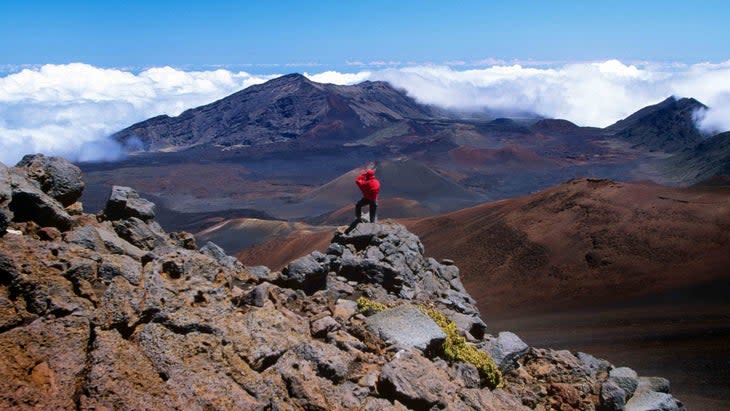 man hiking volcano