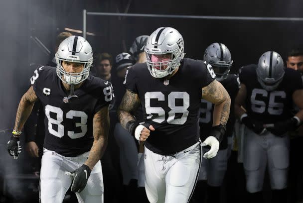 PHOTO: Tight end Darren Waller #83 and center Andre James #68 of the Las Vegas Raiders take the field for warmups before a game against the Los Angeles Chargers at Allegiant Stadium in Las Vegas, Jan. 9, 2022. (Ethan Miller/Getty Images, FILE)