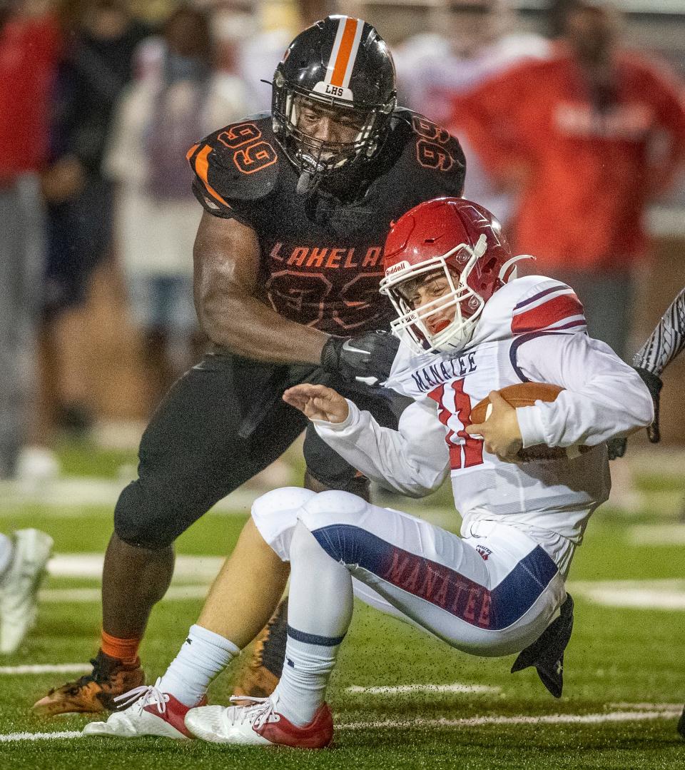 Lakeland Dreadnaughts Gabriel Dindy (99) sacks  Manatee quarterback Jayse Berzowski at Bryant Stadium in September.