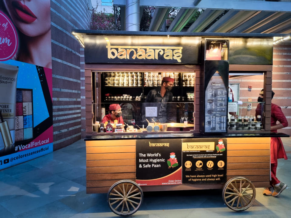 gurgaon, delhi, india - circa 2021 : banaaras paan stall serving royal beetle leaf as a dessert or a traditional after dinner mint snack in India showing pop up stalls of new companies popping up