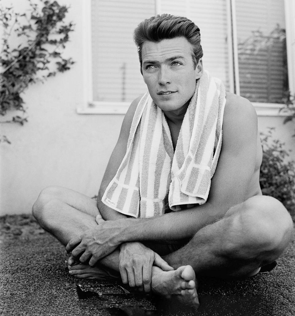 With only a few uncredited roles and bit parts to his name, a then-26-year-old and relatively unknown Eastwood posed for a series of photos by Leaf while exercising at his Los Angeles home in 1956. (Other images from the shoot confirm he was wearing shorts.)