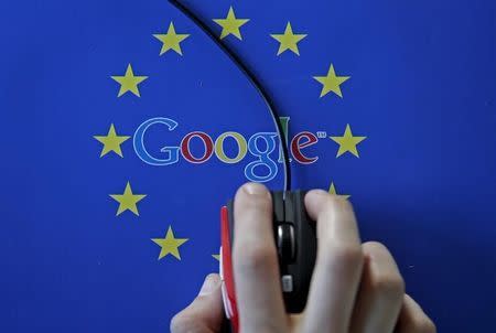 A woman hovers a mouse over the Google and European Union logos in Sarajevo, in this April 15, 2015 photo illustration. REUTERS/Dado Ruvic