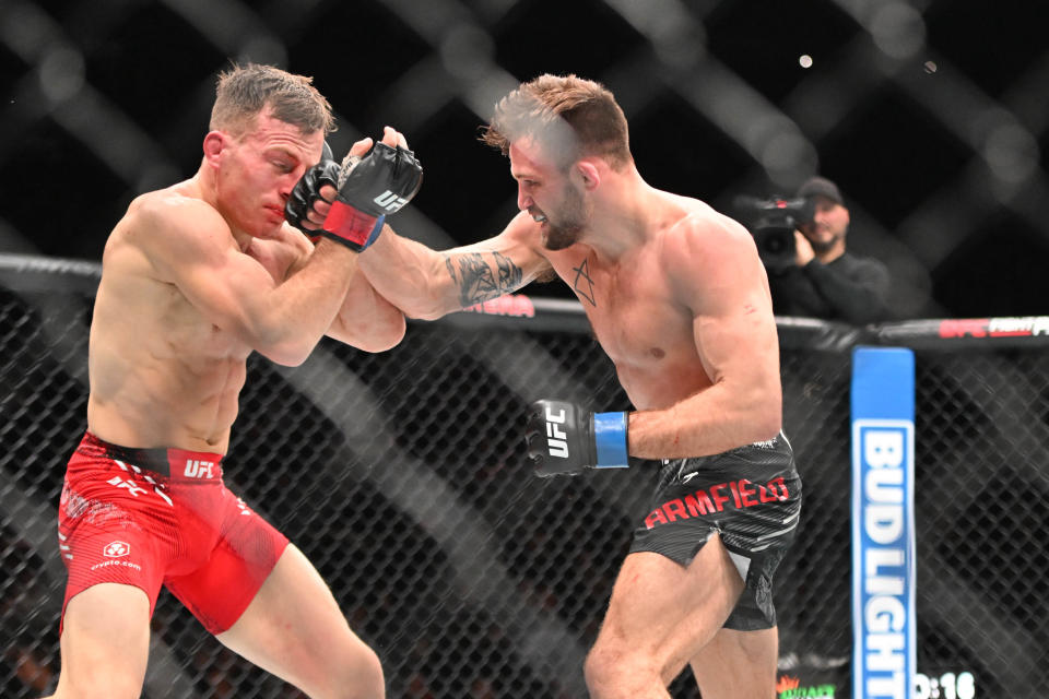 Jan 20, 2024; Toronto, Canada, USA; Brad Katona (red glove) fights Garrett Armfield (blue gloves) during UFC 297 at ScotiaBank Arena. Mandatory Credit: Dan Hamilton-USA TODAY Sports
