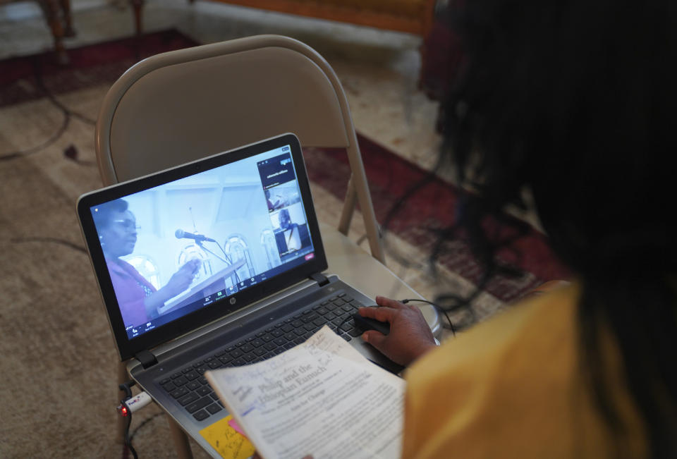 Calvernetta Williams, a long-time congregant of Zion Baptist Church, attends a virtual Sunday school class from her home in Columbia, S.C., on Sunday, April 16, 2023. Williams uses a hybrid model of attending church, Sunday school online, worship service in person, so that she can care for her husband who has Parkinson's. (AP Photo/Jessie Wardarski)