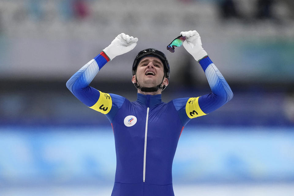 Sergei Trofimov of Team Russian Olympic Committee reacts after their heat during the speedskating men's team pursuit semifinals at the 2022 Winter Olympics, Tuesday, Feb. 15, 2022, in Beijing. (AP Photo/Sue Ogrocki)