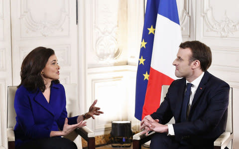 French President Emmanuel Macron talks with Chief Operating Officer of Facebook, Sheryl Sandberg - Credit: THIBAULT CAMUS/AFP/Getty Images