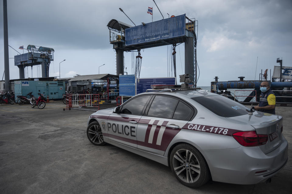 Thai immigration police, pictured here at the ferry pier where Shane Warne's body was transferred.