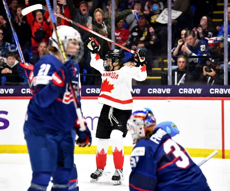 Canada's Danielle Serdachny celebrates her gold medal-winning goal in overtime against the United States in the final of the Women's Ice Hockey World Championship in Utica, New York (Troy Parla)